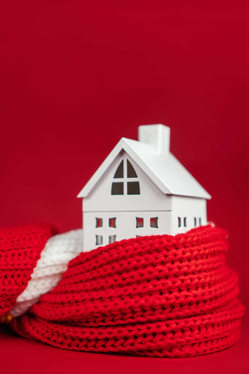 white-toy-house-wrapped-red-scar